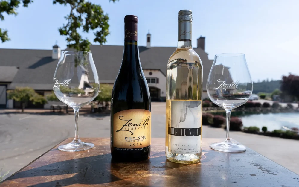 Two bottles and two glasses of Zenith Vineyard wine