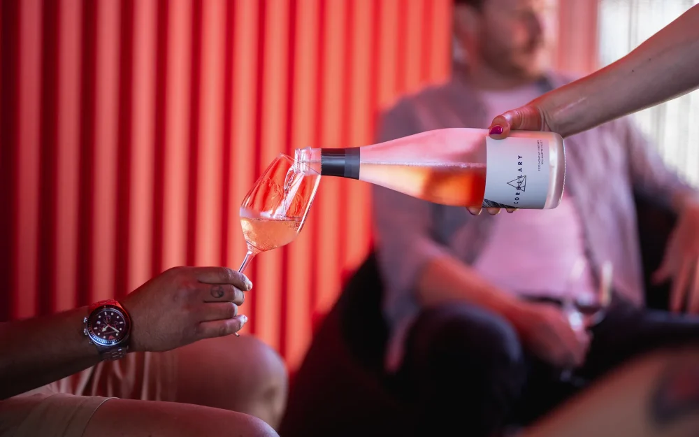 Pouring a glass of Corollary wine