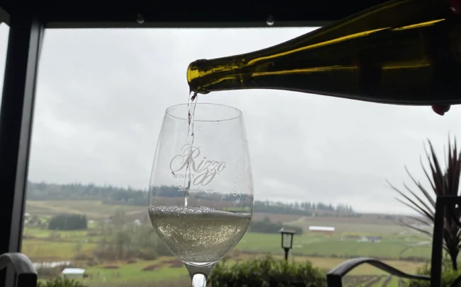 Pouring a glass of Rizzo wine